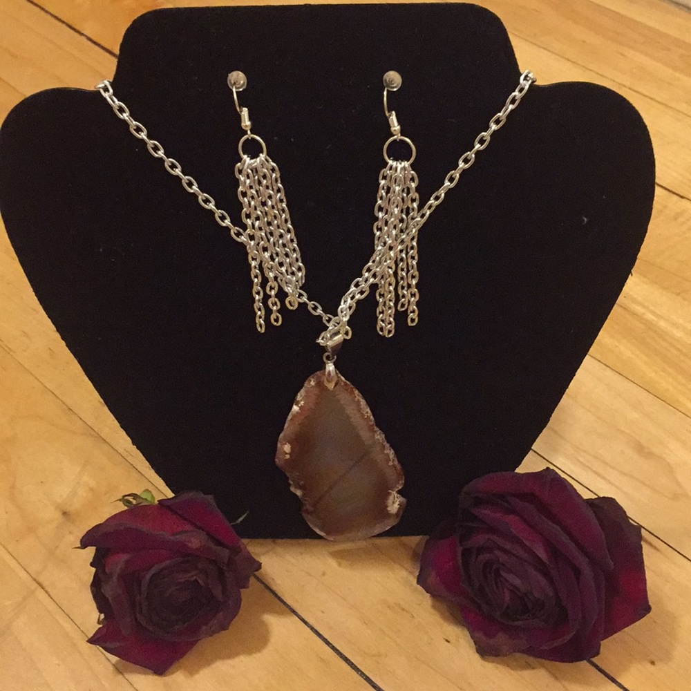 Natural brown stone pendant on silver chain.